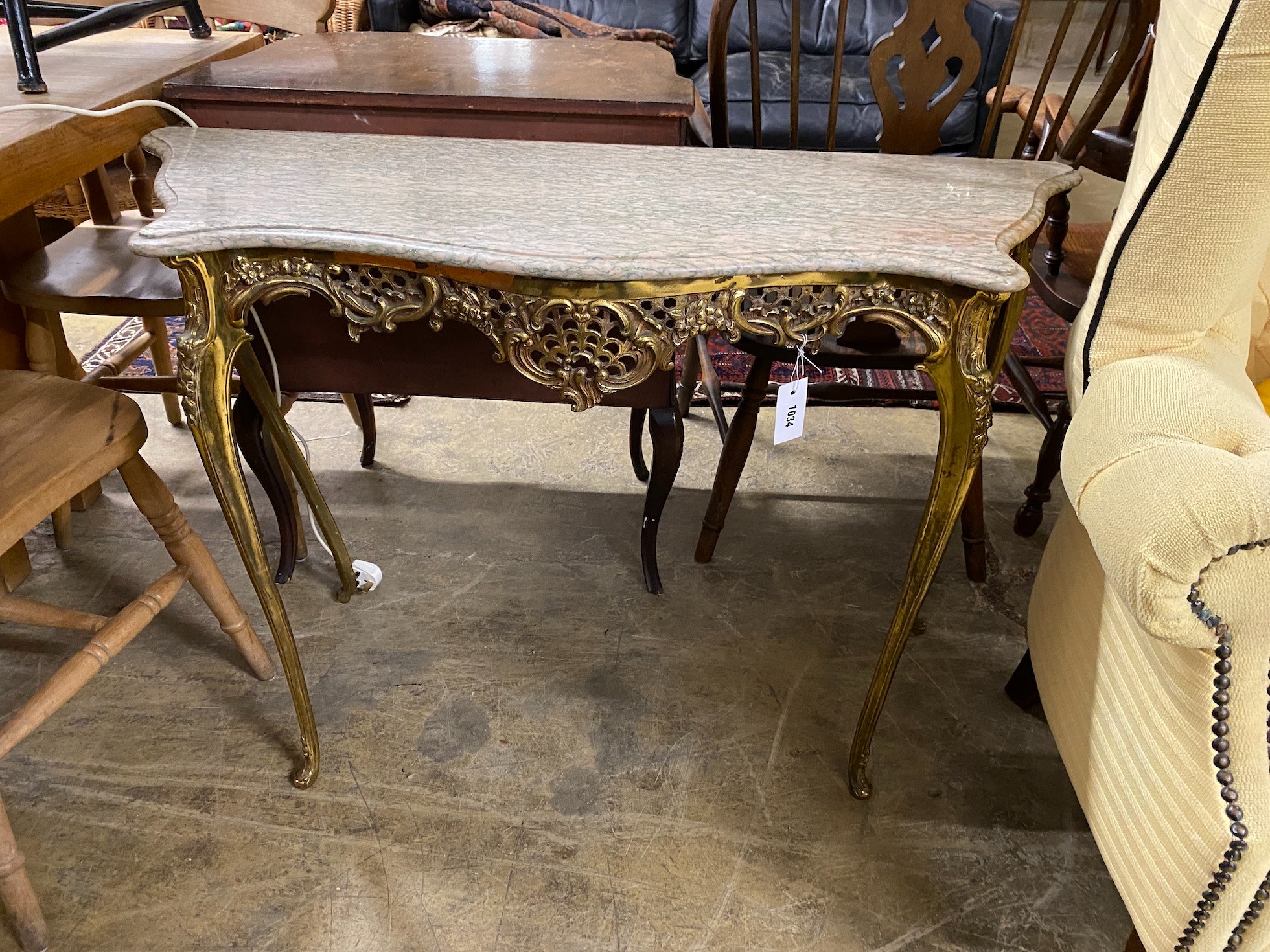 A cast brass console table with serpentine marble top, width 110cm, height 74cm